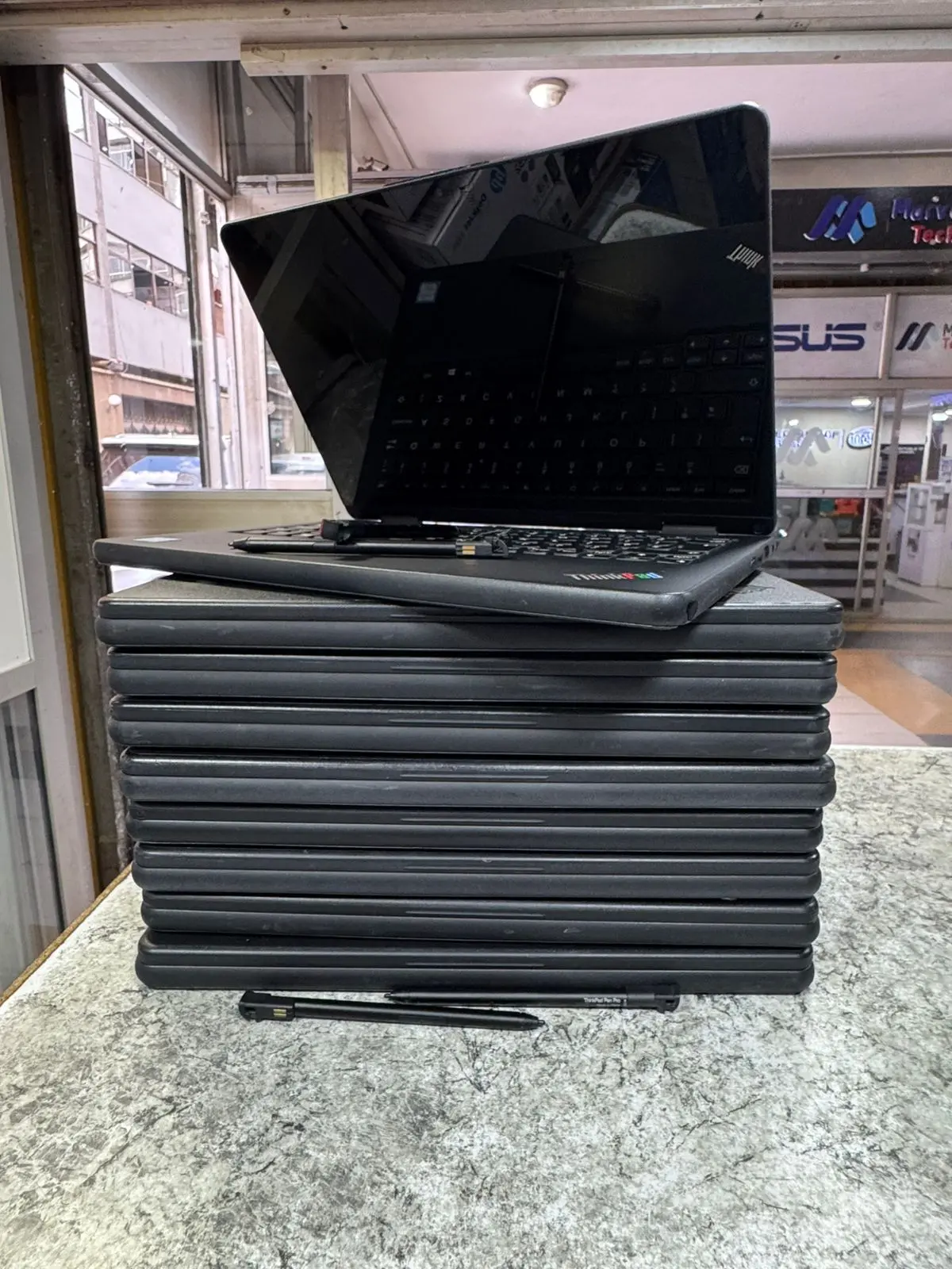 Laptop Stack with Open Laptop